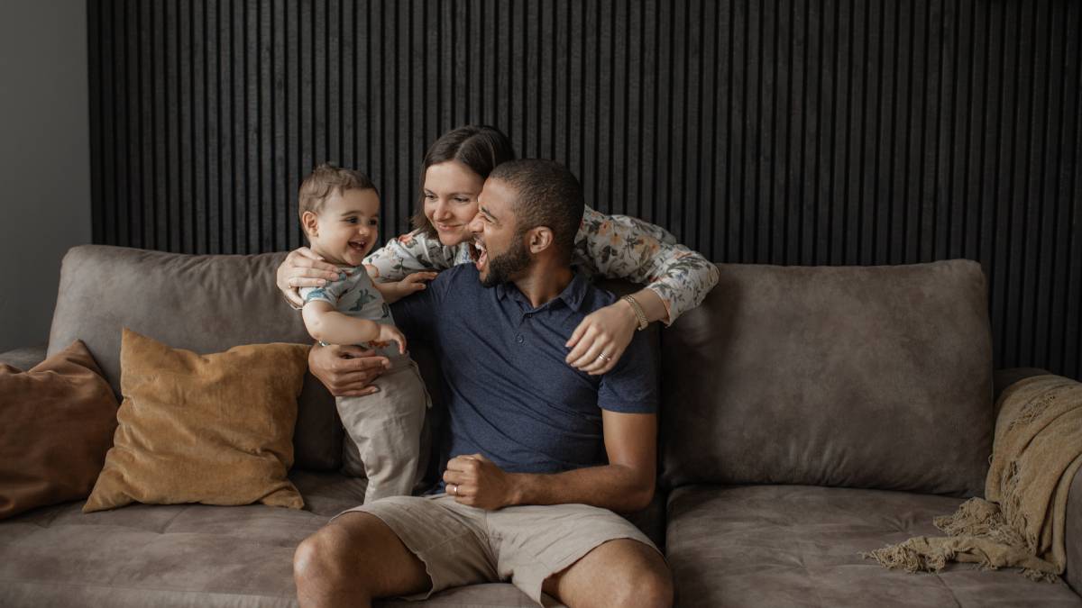 Happy family sitting on couch